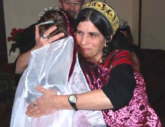 hugging the bride